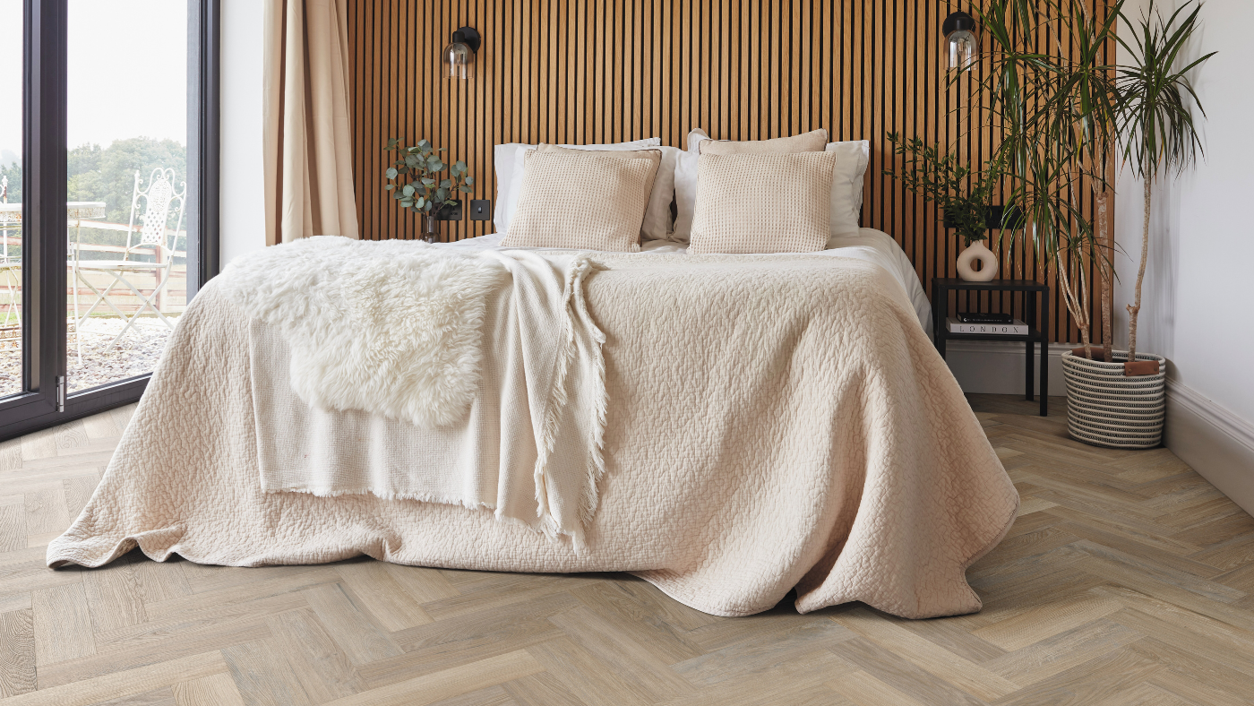 Karndean Hayfield Oak herringbone wood flooring in a bedroom