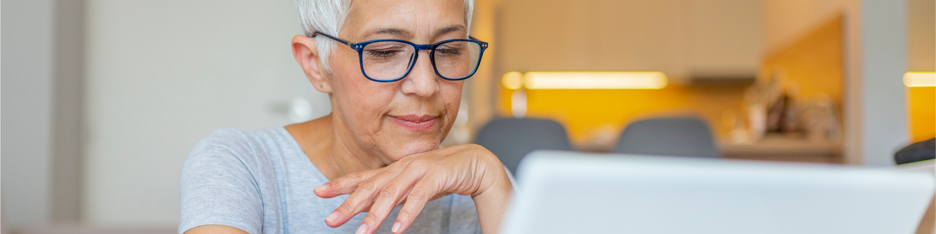 Older woman looking at laptop