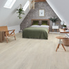 A frame ceiling bedroom with green velvet bed and leather chair with Grey Scandi Pine KP131 floors