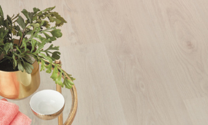 Pearl Oak floor with a plant, bowl and pink towel on a glass side table