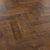 Dark brown herringbone LVT flooring by Karndean from an angle